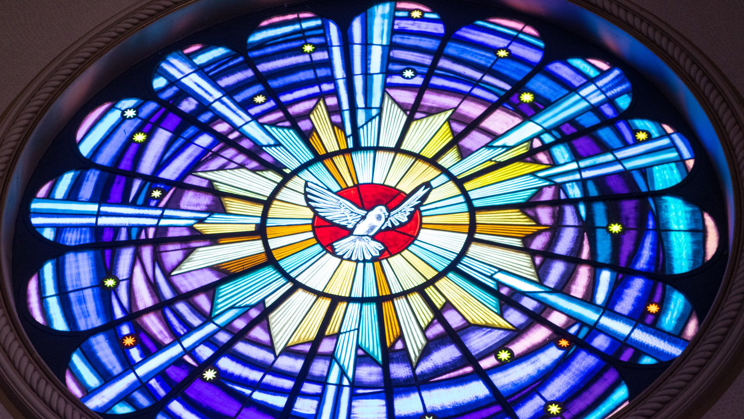 Stained glass image of Holy Dove